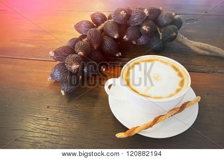 Hot Coffee In Cup And Twisted Sweet Stick Biscuit And Fruit Decoration Wooden Table With Filtered Im