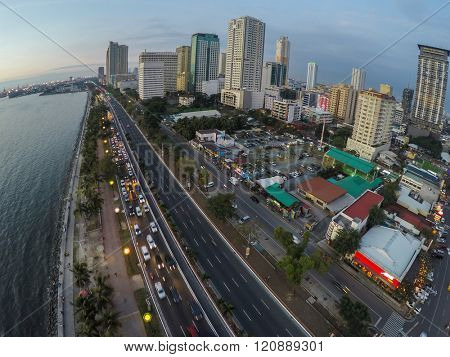 Manila, Philippines - January 19, 2015: Roxas Boulevard, Manila at evening, high-rise buildings skyscrapers with night lights.