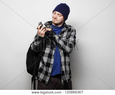 technology, people and life style concept: young  photographer over white background