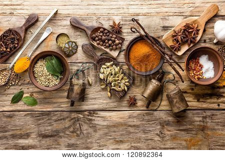 various spices on wooden background