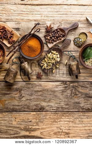 various spices on wooden background