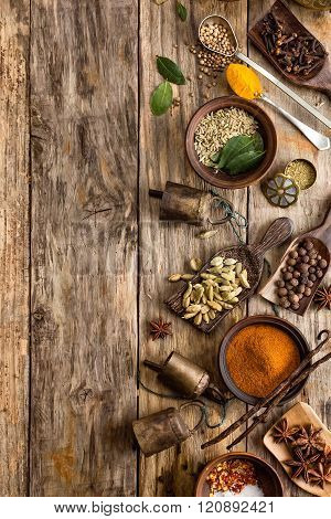 various spices on wooden background