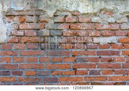 Reddish Brown Brick Wall With Plaster