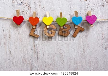 Lgbt Rainbow And Hearts On A White Wooden Background