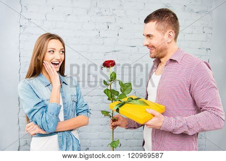 Handsome Man Holding Red Rose And Gift For His Wife
