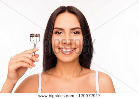 Close Up Portrait Of Smiling Girl Holding Culer For Eyelashes