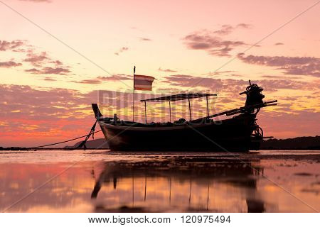 Long tail fishing boats at sunet in Thailand