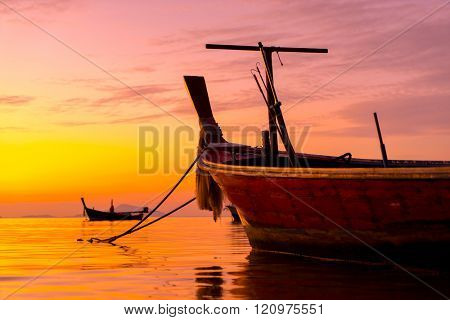Long tail fishing boats at sunet in Thailand