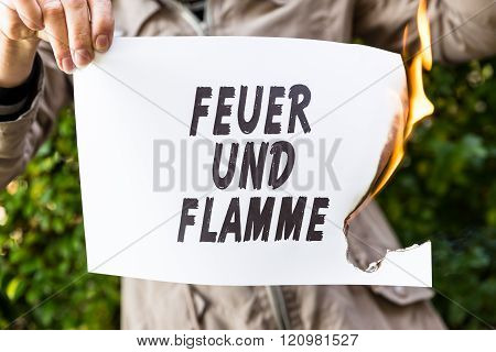 Woman Is Holding A Burning Paper With German Text