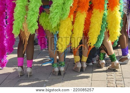 The beautiful legs of women dancers of the Pacific and caribbean beach