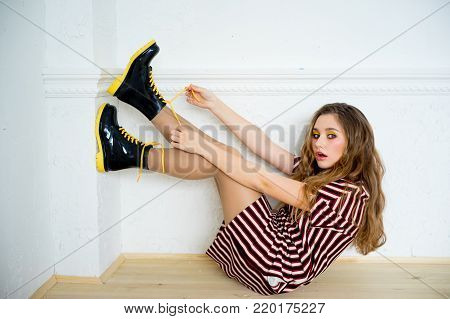 A portrait of a teen girl model in a stdio
