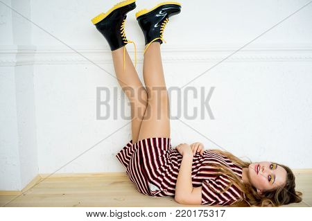 A portrait of a teen girl model in a stdio