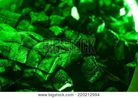 blurred pattern of green kriptonite stone macro mineral for background, weapons against superman.