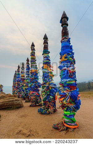 Wooden Ritual Pillars With Colorful Ribbons Hadak On Cape Burkhan. Lake Baikal. Olkhon Island. Russi