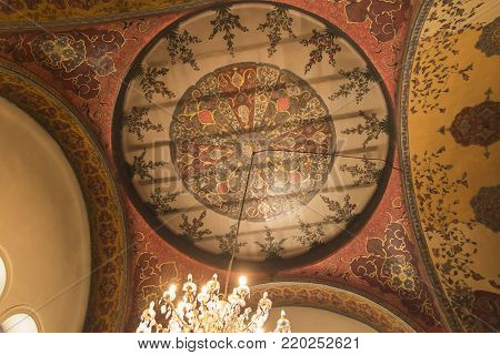 VAGHARSHAPAT, ARMENIA - SEPTEMBER 17, 2017: The decor of the main entrance to Etchmiadzin Mother Cathedral, includes gilt relief Byzantine patterns