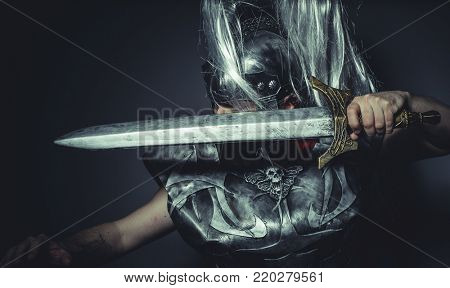 Empire, Roman centurion with armor and helmet with white chalk, steel sword and long red cape