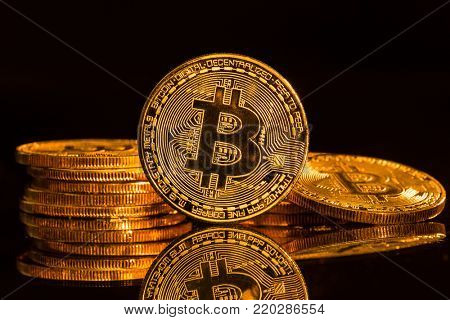 Bitcoin gold coins with defocused abstract background. Virtual cryptocurrency concept.