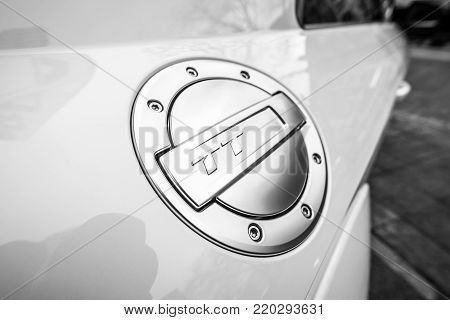 BERLIN - DECEMBER 21, 2017: Showroom. Fuel tank cap of the compact sports coupe Audi TT RS. Since 2016. Black and white.