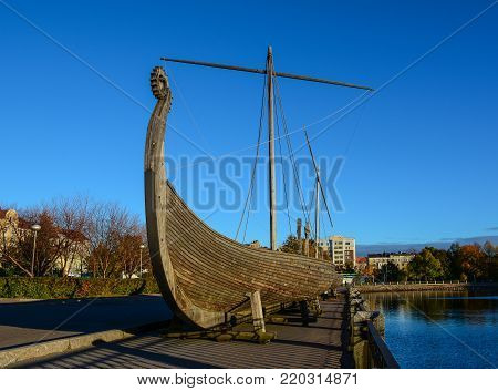 Vyborg, Russia - Oct 5, 2016. Drakkar (Viking wooden boat) on the waterfront in Vyborg, Russia. Vyborg is 174km northwest of St Petersburg, and just 30km from the Finnish border.