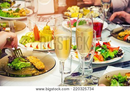 champagne on the festive table salad food