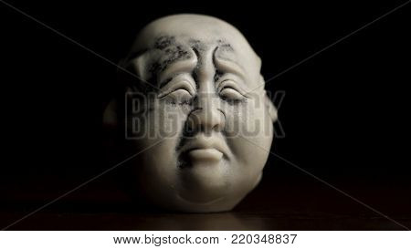 Spiritual Enlightenment. Head Statue With An Emotion Sadness. Museum Quality Statuette Against Black