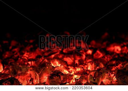 Wooden coils and fire in a fireplace or an old cooking stove