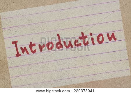 Word Introduction handwritten on a paper in red color