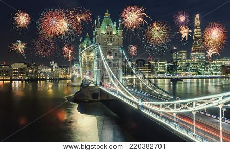 View of the Tower Bridge in London at new years eve with amazing fireworks. ideal for websites and magazines layouts