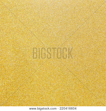 Gold and silver glitter texture background of golden yellow hot foil leaf bright metallic Christmas holiday decoration backdrop design element