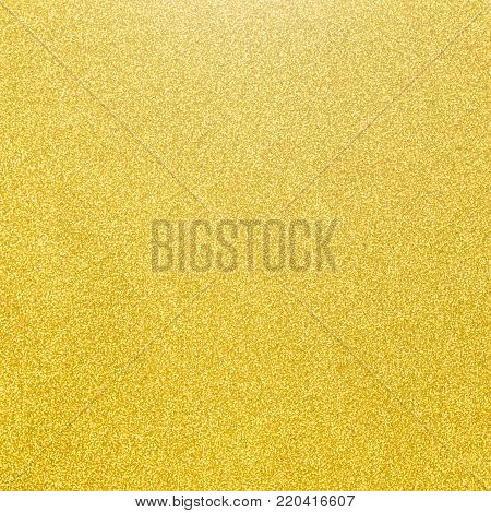 Gold glitter texture background of golden yellow hot foil leaf bright metallic Christmas holiday decoration backdrop design element