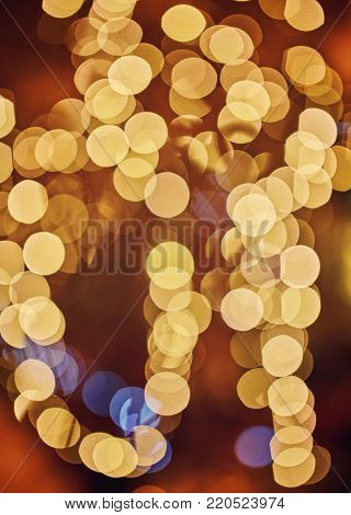 Abstract New Year's festive blurring background. Garland, side.
