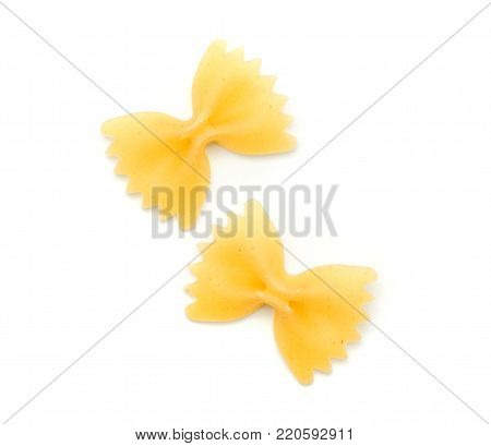 Two raw farfalle pasta isolated on white background top view