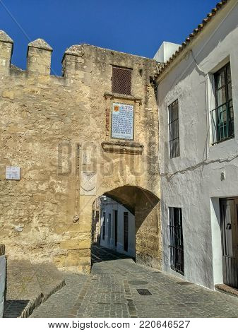 Wall and door. Vejer, Andalucia, Spain. 07/07/2017: Detail of the historic stone wall.