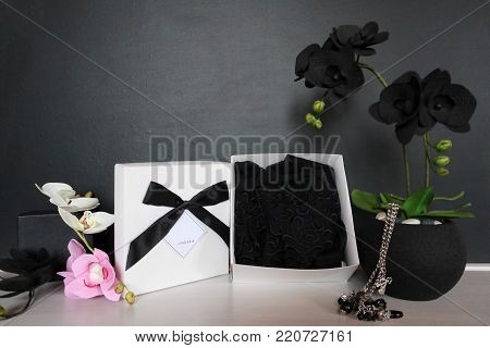 Gift Box With A Sexy Lingerie. Flowers And Present For The Women. Festive Underwear Gift With Black