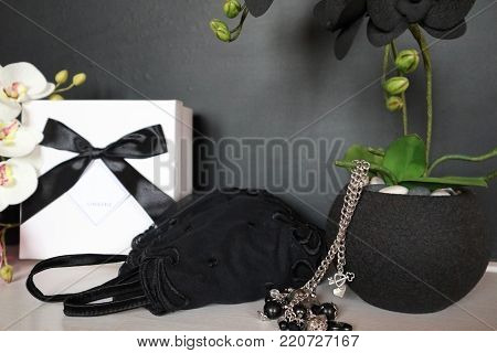Gift Box With A Sexy Lingerie. Flowers And Present For The Women. Festive Underwear Gift With Black