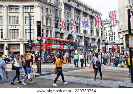 London, Uk - July 7, 2016: People Shop At Oxford Circus In London. Oxford Street (crossing Oxford Ci