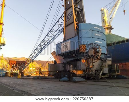 Novorossiysk, Russia - August 11, 2016: Self-propelled port crane. Mobile platform for moving the lifting mechanism.