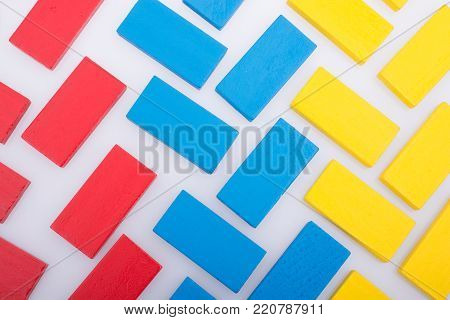 Colorful Domino Blocks in a line on a white background