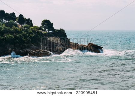 The waves beat against the rocks. Ulcinj, Montenegro. Adriatic Sea