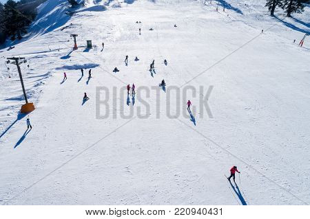 Aerial View Of Skiers At Ski Resort Vasilitsa In The Mountain Range Of Pindos, In Greece.