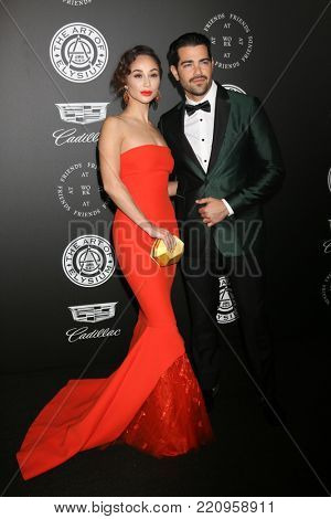 LOS ANGELES - JAN 6:  Cara Santana, Jesse Metcalfe at the The Art of Elysium presents John Legend's HEAVEN at Barker Hanger on January 6, 2018 in Santa Monica, CA