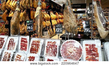 Torrevieja, Spain - March 16, 2017: Variety of meat products in a Carrefour supermarket. Carrefour is a French multinational retailer, and one of the largest hypermarket chains in the world