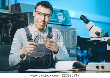 quality control part metal worker machine male