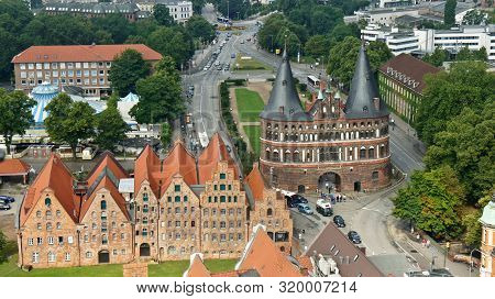 Top View Of Holsten Gate Or Holstentor And Salzspeicher Warehouses In Old Town, Beautiful Architectu