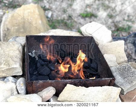 Fire Flame Close-up In Grill. Grilling Outdoors
