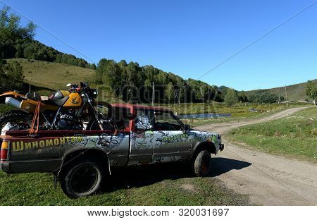 Altai Region, Russia - September 6, 2018:japanese Datsun 720 Pickup Truck On Field Road In The Vicin