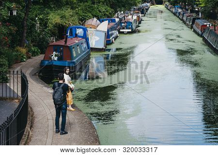London, Uk - July 18, 2019: View Of Man Taking Photos Of His Girlfriend On Regents Canal In Little V