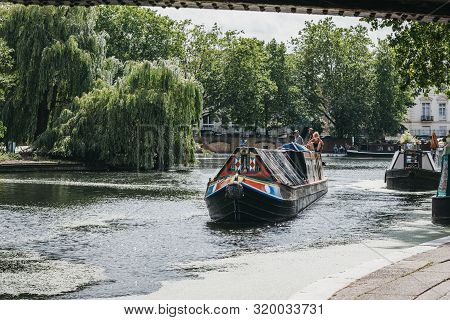 London, Uk - July 18, 2019: View From Under The Bridge Of Boats On A Sunny Day On Regents Canal In L