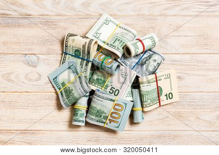 Stacks Of One Hundred Dollars Banknotes Close-up On Colored Background Business Concept Top View Wit
