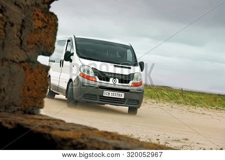 Kherson, Ukraine - August 6, 2019: White Renault Trafic On A Field Background